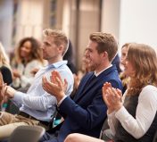 Audience Applauding Speaker After Conference Presentation